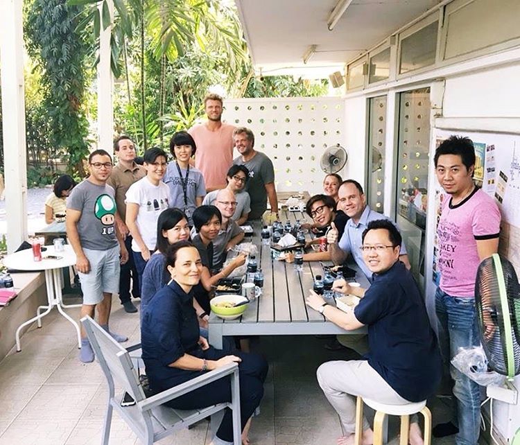 coworkers gathered at a dining table in Hubba thailand