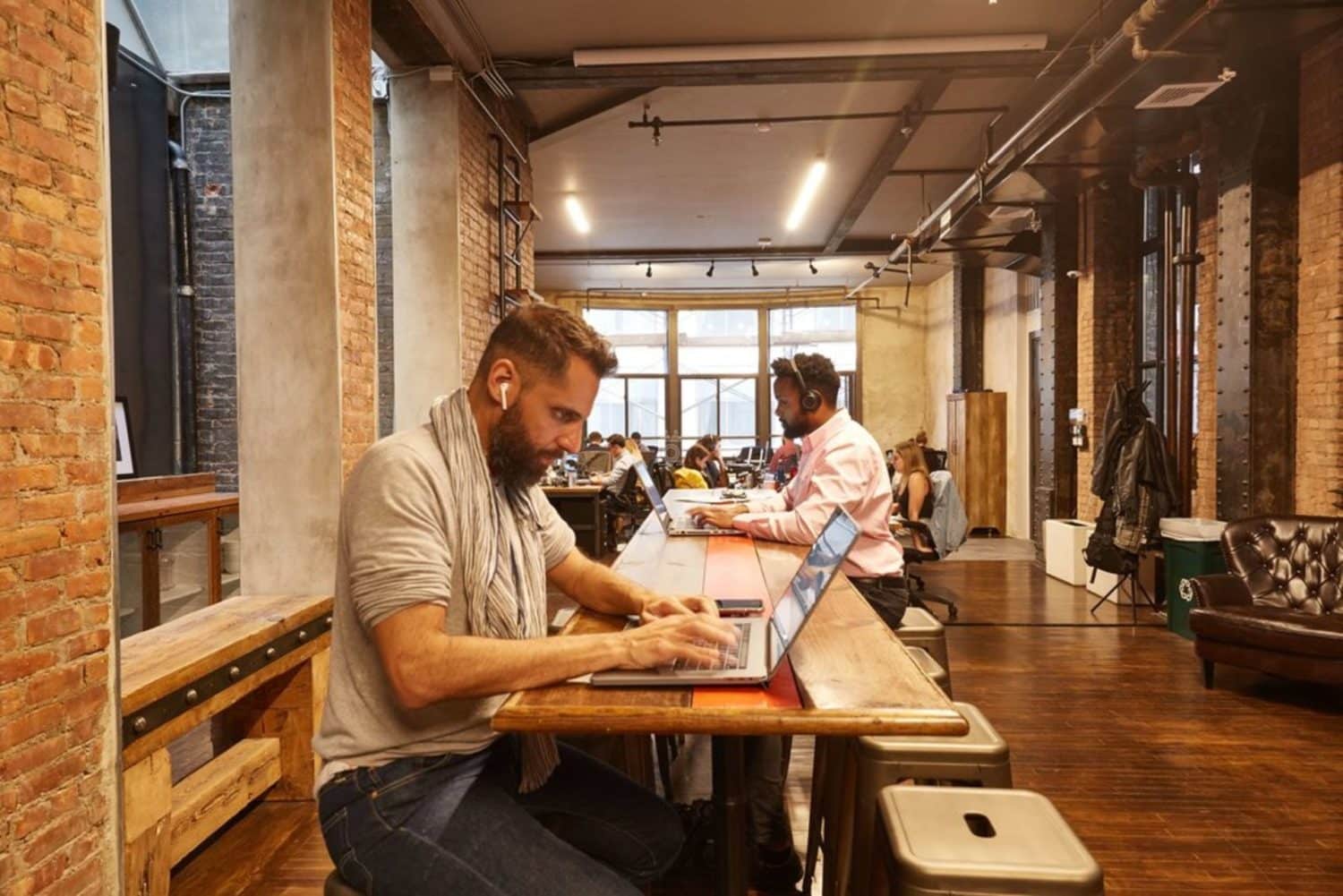 people working at a coworking space in soho new york city
