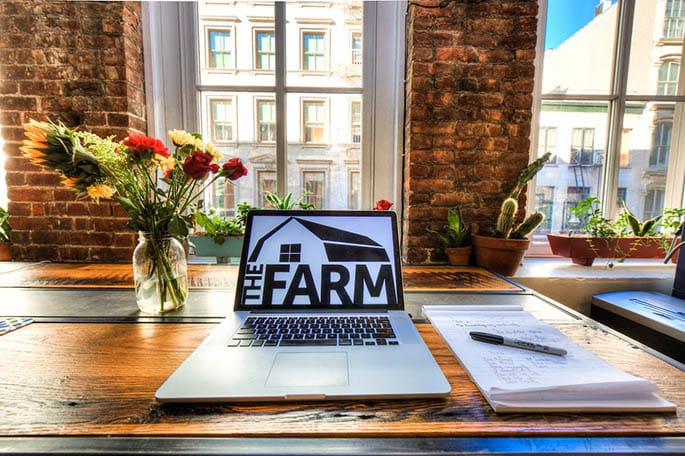 a laptop on an office desk in the farm soho nyc