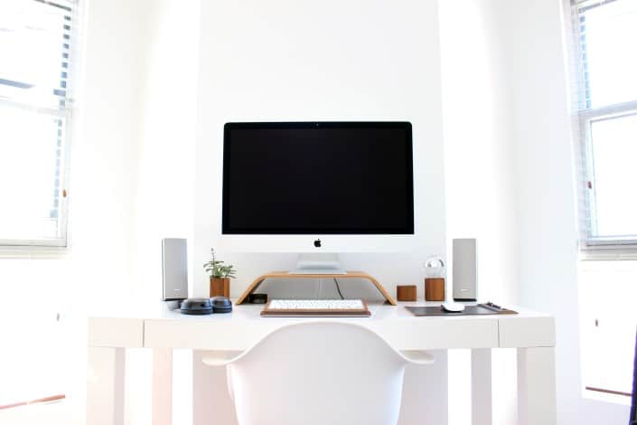 an all-white all-in-one desktop computer