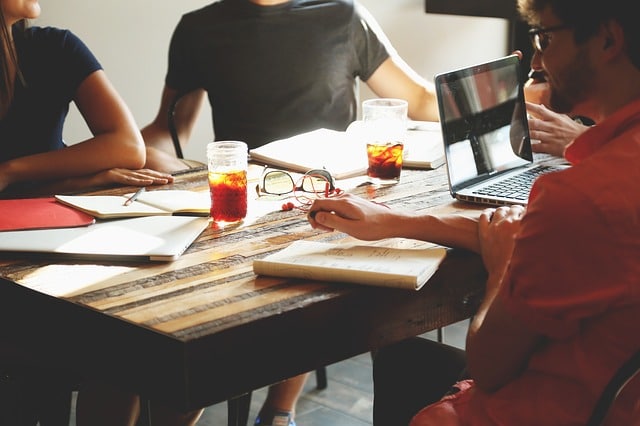 people discussing their plans at a coworking desk