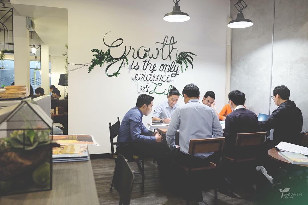 A group of employees working in a coworking space