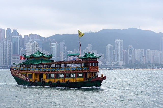 a boat cruising on hong kong waters