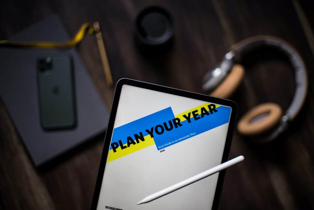 tablet showing the phrase plan your year stay motivated as entrepreneurs