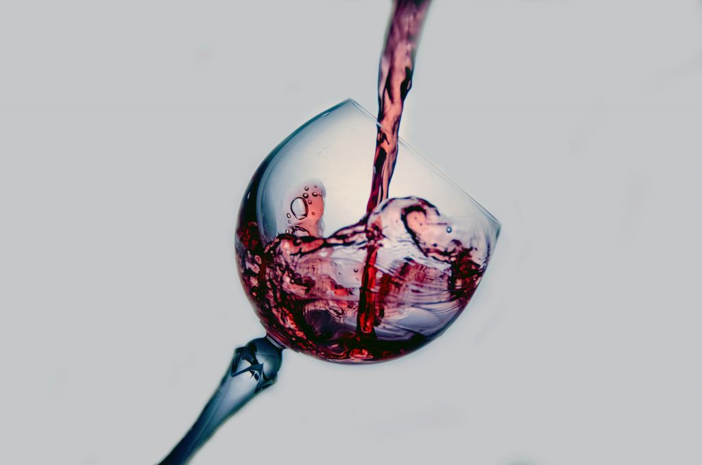 wine being poured onto a glass