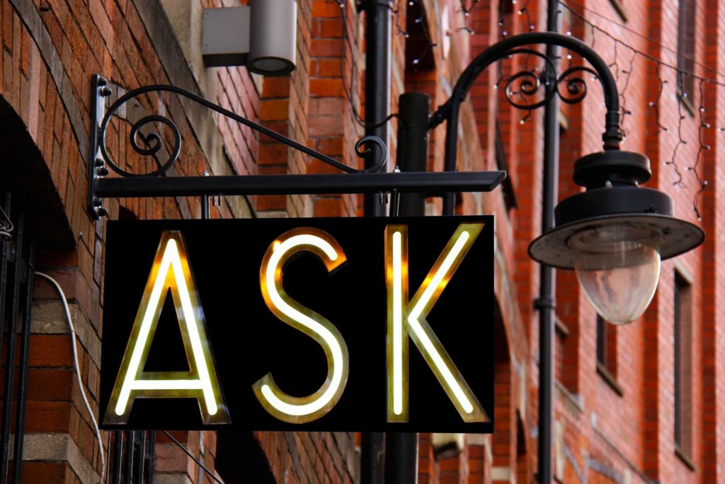 signage that says ask