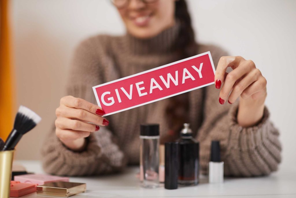 person hosting a giveaway to boost social media engagement