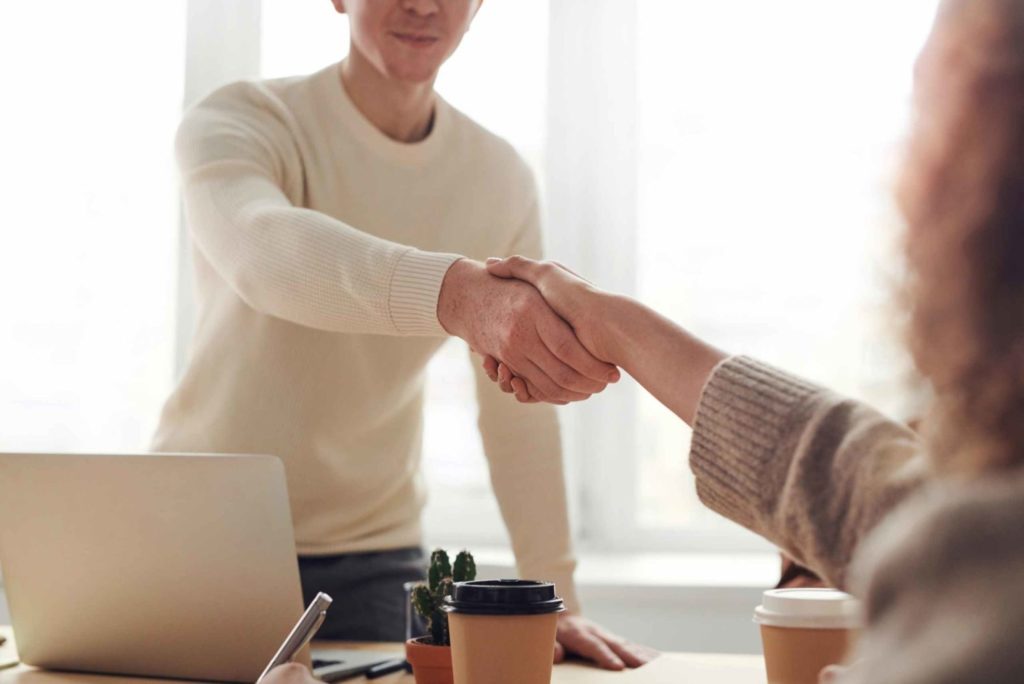 man shaking the hand of an employee