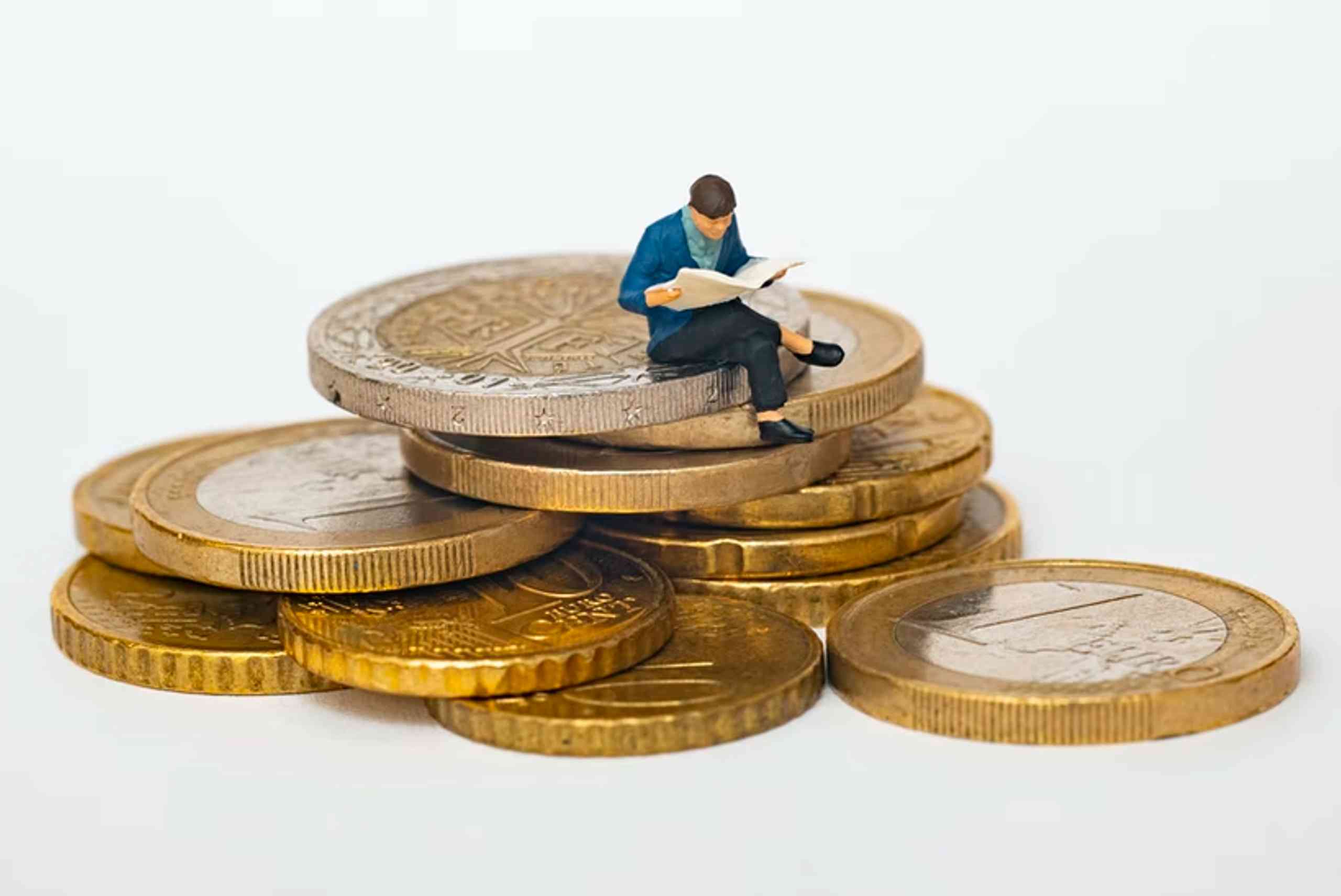 figure sitting on coins