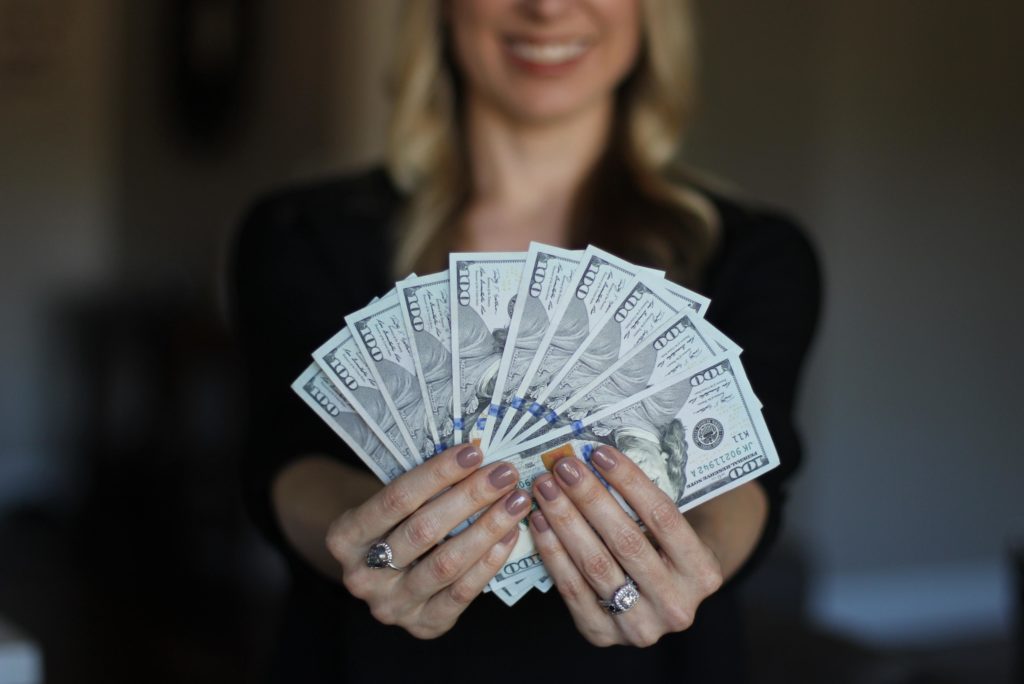 woman showing off money
