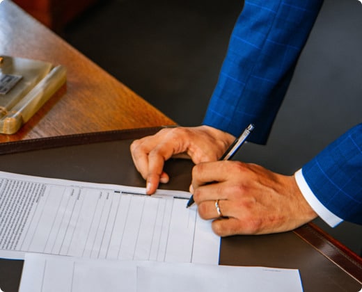 a man signing a paper